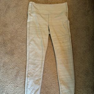 Medium athleta leggings with a small hole in the thigh